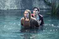 Teresa Palmer and Nicholas Hoult wade in water while filming Warm Bodies