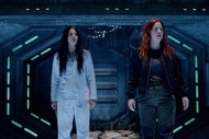 Kate Hawthorne and D'Arcy Bloom stand on an alien ship on Resident Alien Episode 308.