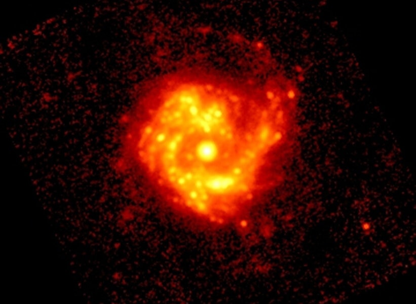In the infrared, taken with the Spitzer Space Telescope, the very bright core of M61 is obvious. Credit: NASA/JPL-Caltech