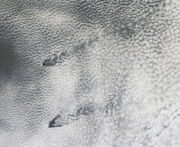 A pair of parallel von Kármán vortices shed off of Pacific islands. Click to embiggen. Credit: NASA/Jeff Schmaltz/LANCE MODIS Rapid Response