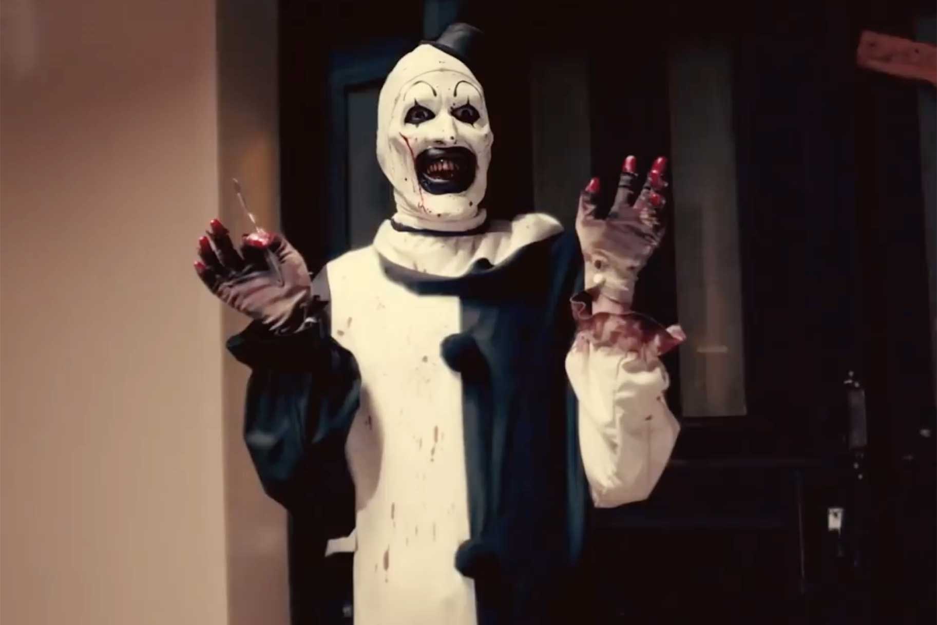 A scene of Art the Clown with blood on his hands from Terrifier