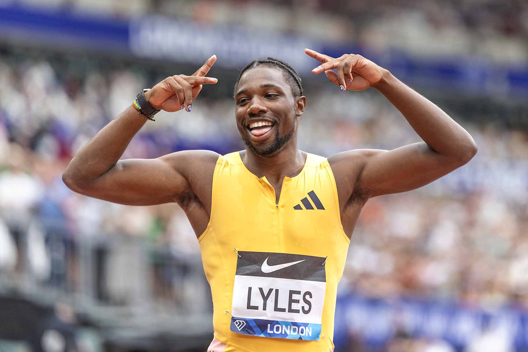 Noah Lyles celebrates a win.