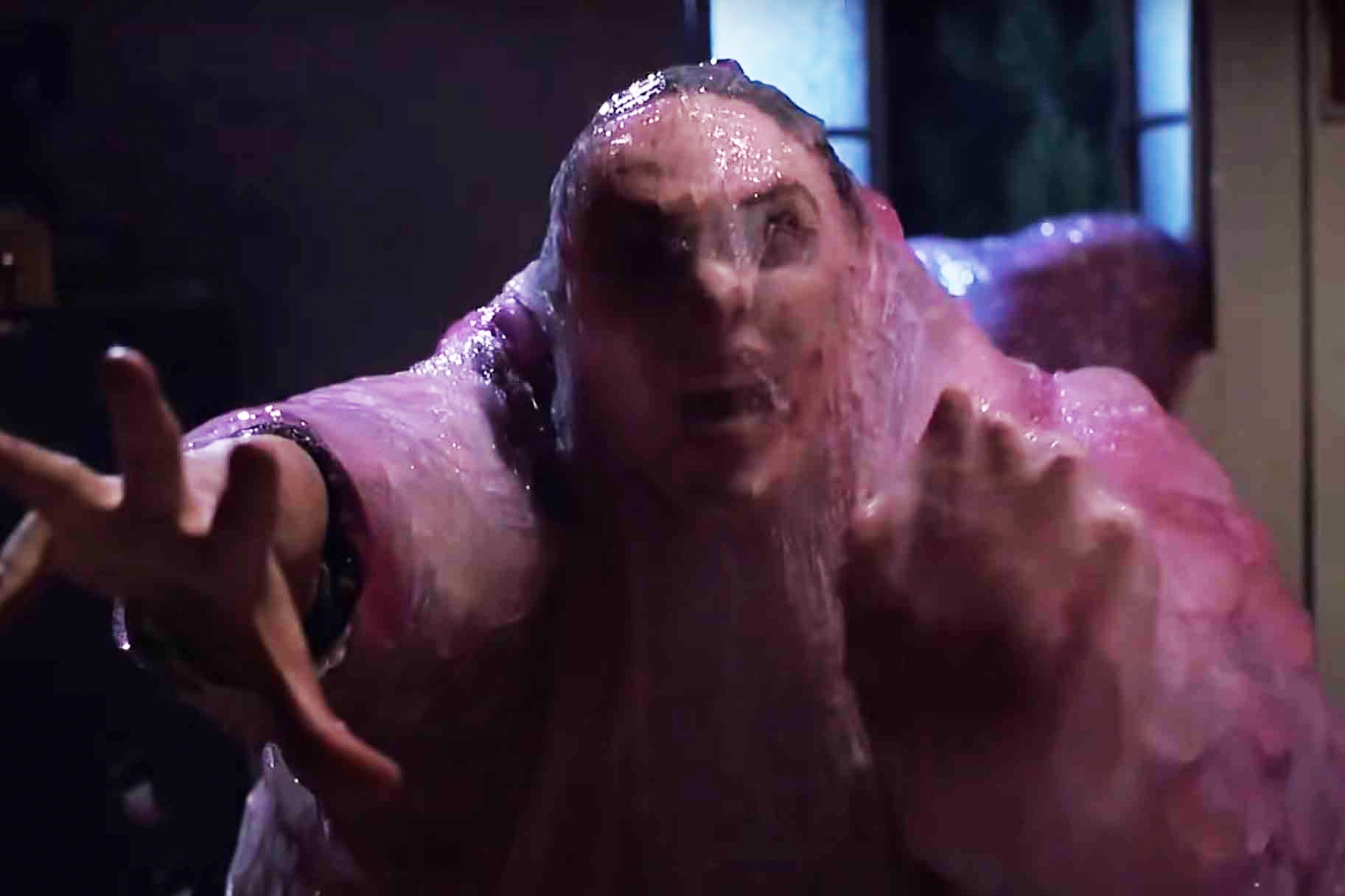 Paul (Donovan Leitch) screams while getting dragged into a fleshy blob in The Blob (1988).