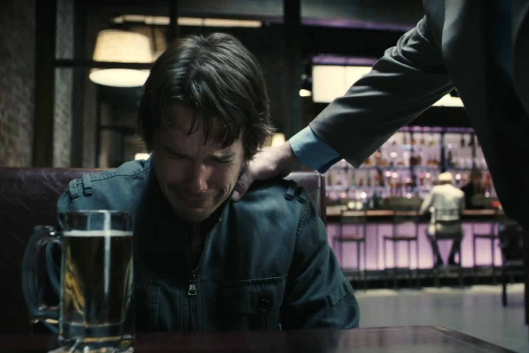 Hank (Ethan Hawke) cries as a hand grabs his shoulder in Before the Devil Knows You're Dead (2007).