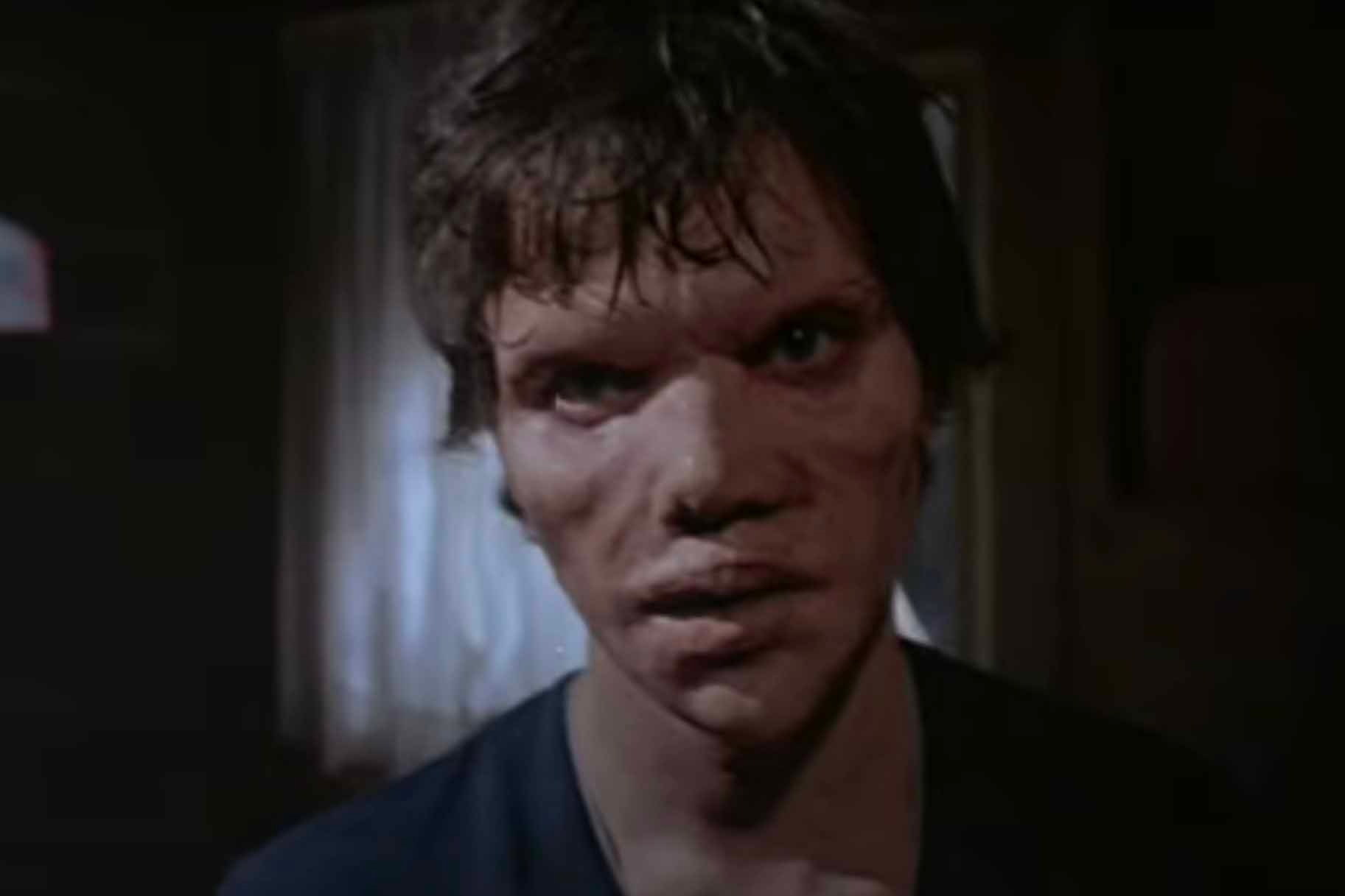 Sonny Montelli (Jack Magner) has a distorted face in Amityville 2: The Possession (1982).