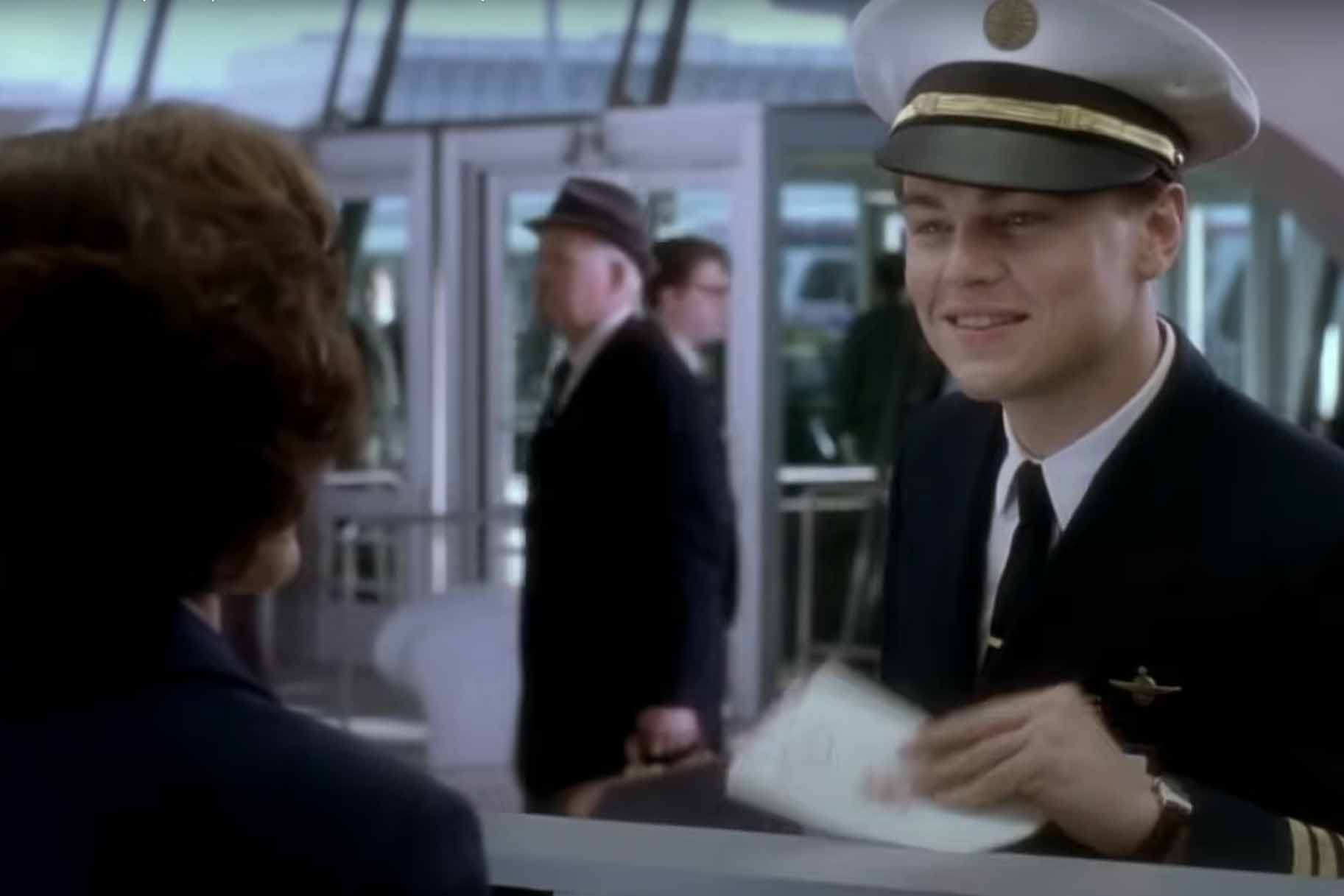 Frank Abagnale, Jr. (Leonardo DiCaprio) wears a sailor's hat to a bank in Catch Me if You Can (2002).