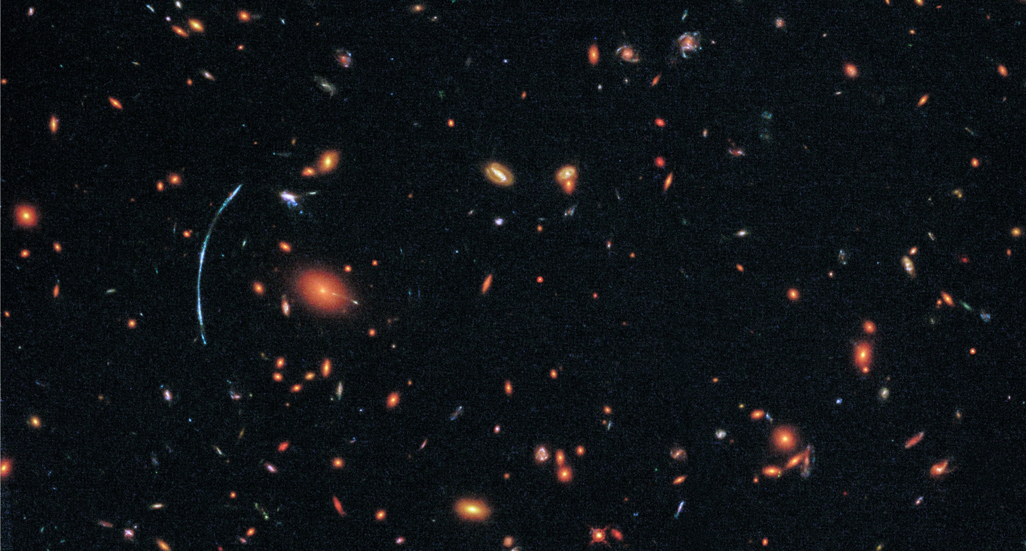 The “true” shape of the lensed galaxy (right, inset), reconstructed by mapping out the structure of the galaxy cluster and determining how it distorted the light of SGAS 1110 on its way to Earth. Credit: NASA, ESA, and T. Johnson (University of Michigan)