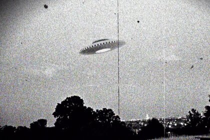 A black and white stylized photo of a UFO