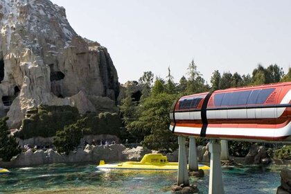 Disneyland Monorail passing by its Matterhorn Mountain