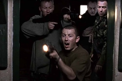 The cast of Dog Soldiers (2002) shoots guns.
