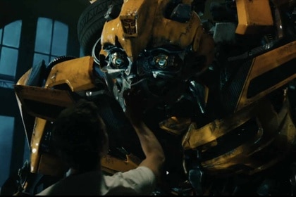 A man pets Bumblebee in Transformers Dark of the Moon (2011)