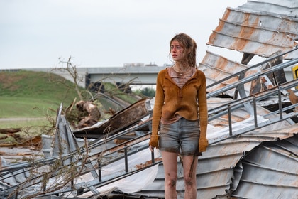 Kate stands on top of a collapsed building in Twisters