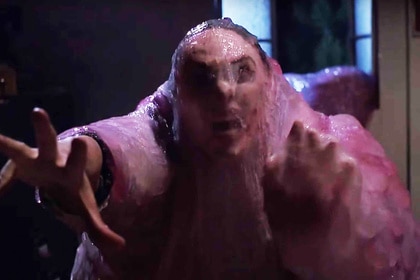 Paul (Donovan Leitch) screams while getting dragged into a fleshy blob in The Blob (1988).