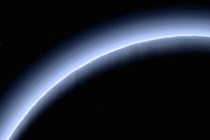 Pluto backlit by the Sun