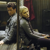 (l-r) Jamie Bamber as Captain Lee 'Apollo' Adama, Katee Sackhoff as Lieutenant Kara 'Starbuck' Thrace in BATTLESTAR GALACTICA