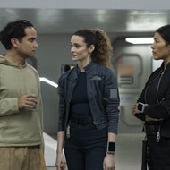 Ian (Reece Ritchie), Lt. Sharon Garnet (Christie Burke), and Kimi (Diana Bermudez) stand and chat on The Ark Episode 209.