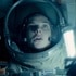 Miranda North (Rebecca Ferguson) holds a flashlight in a space suit in Life (2017).