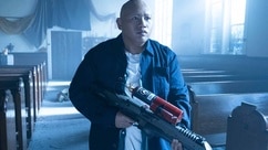 Reginald Andres (Jacob Batalon) holds a weapon in a church on Reginald the Vampire Episode 210.