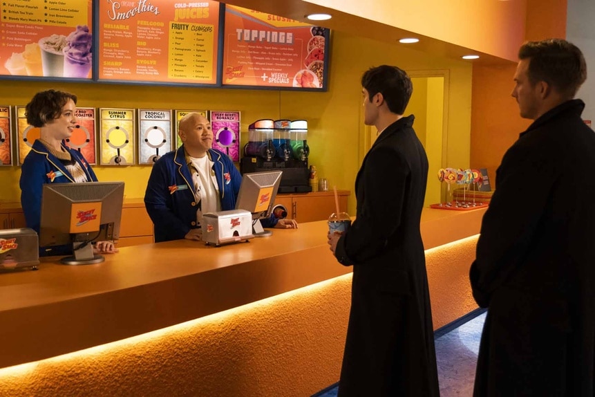 The cast chats around the Slushy Shack cash registers in Reginald The Vampire Episode 201.