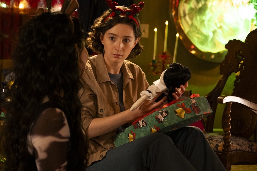 Ashley Weeks (Marguerite Hanna) holds a doll Christmas present on Reginald the Vampire Episode 207.