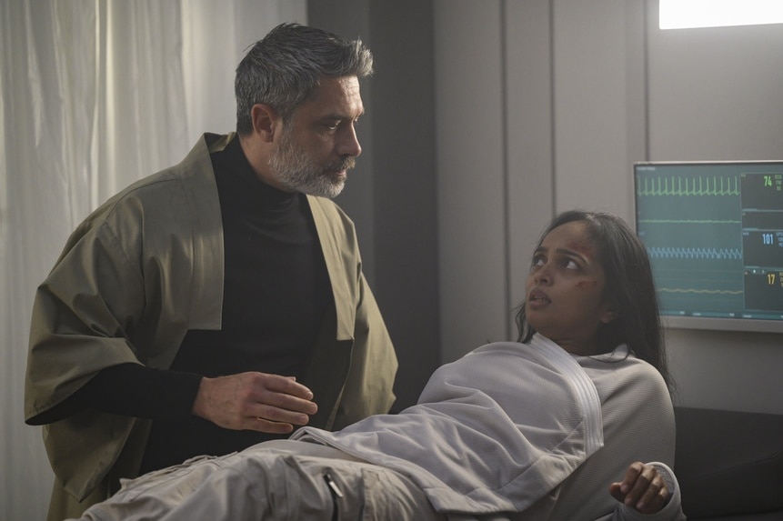 Dr. Marsh (Jadran Malkovich) tends to an injured Dr. Sanjivni Kabir (Shalini Peiris) on The Ark Episode 203.