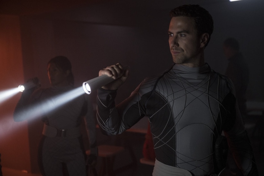 Lt. James Brice (Richard Fleeshman) holds a flashlight in The Ark Episode 205.