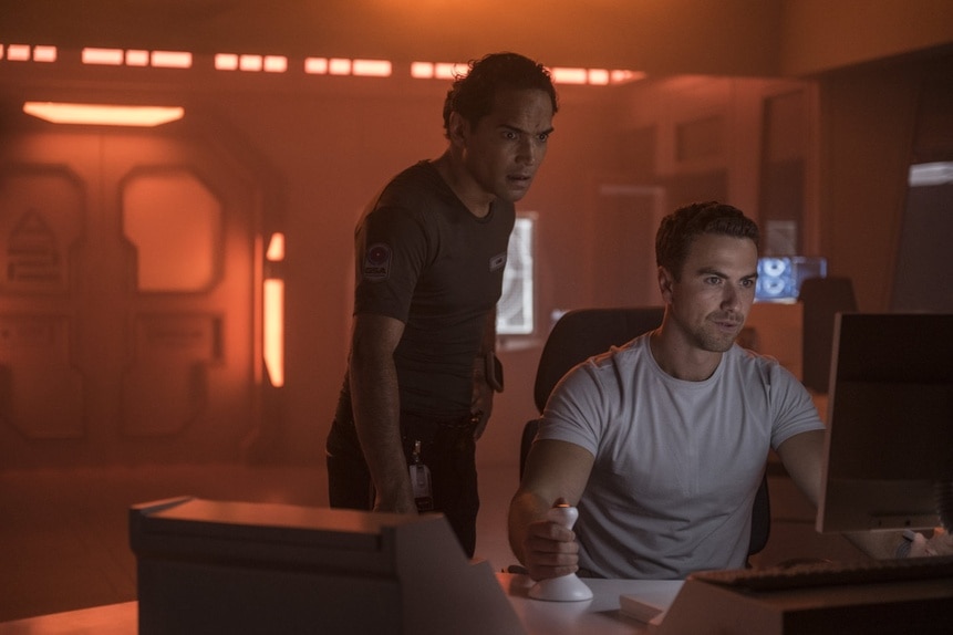 Lt. Spencer Lane (Reece Ritchie) and Lt. James Brice (Richard Fleeshman) look at a computer in The Ark Episode 205.