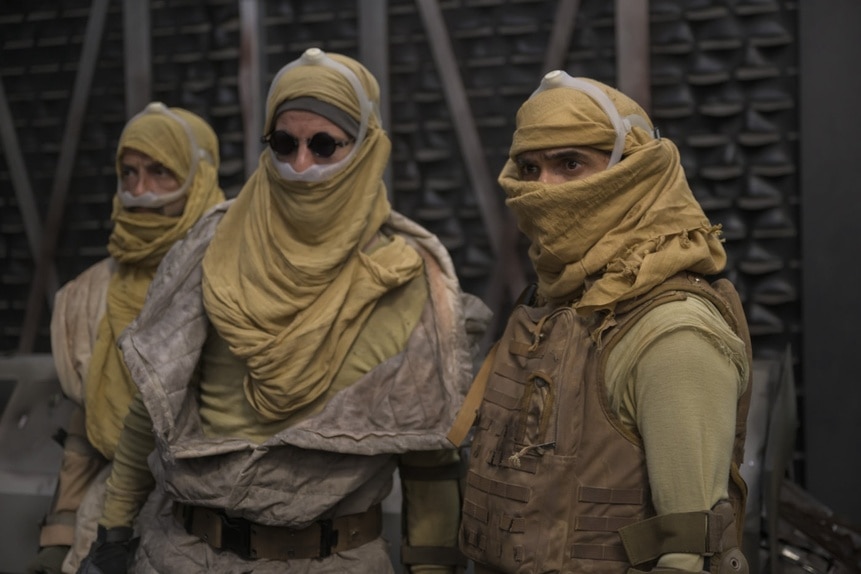 Three men wear yellow headscarves on The Ark Episode 206.