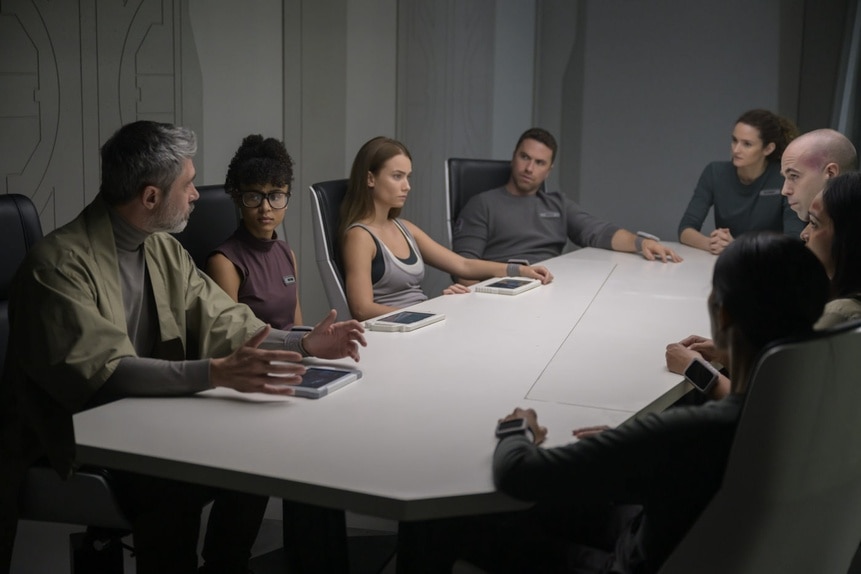 The cast sits around a large white table on The Ark Episode 206.