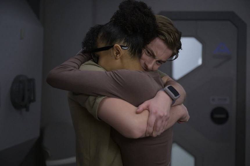 Alicia Nevins (Stacey Read) and Angus Medford (Ryan Adams) hug on The Ark Season Episode 207.