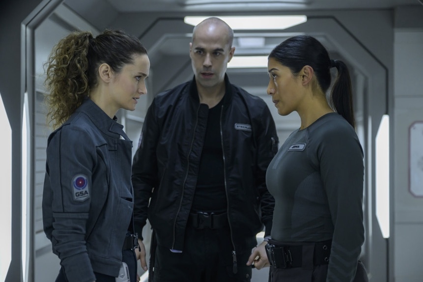 Lt. Sharon Garnet (Christie Burke), Felix Strickland (Pavle Jerinic), and Kimi (Diana Bermudez) speak on The Ark Season Episode 207.