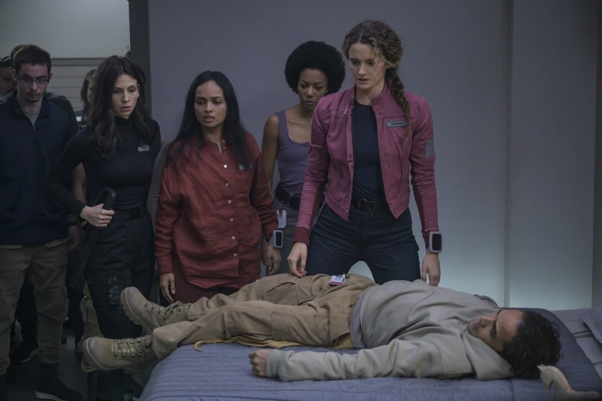 The cast gathers around a incapacitated body on The Ark Episode 212.