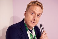 Alan Tudyk holds his glasses