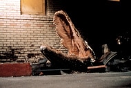 A still from the movie Alligator (1980) of an alligator coming out of a manhole