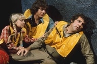 Holly Marshall (Kathy Coleman), Will Marshall (Wesley Eure), and Park Ranger Rick Marshall (Spencer Milligan) wear life jackets in Land of the Lost.