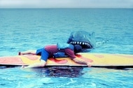 A shark approaches a surfer in Jaws 2 (1978).