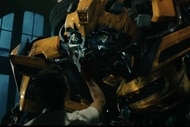 A man pets Bumblebee in Transformers Dark of the Moon (2011)