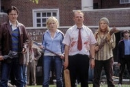 The cast of Shaun of the Dead (2004) hold weapons.