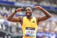 Noah Lyles celebrates a win.