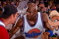 Bugs Bunny, Michael Jordan, and Lola Bunny speak to a man in Space Jam (1996).