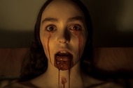 Ellen Hutter (Lily-Rose Depp) bleeds from her eyes and mouth in Nosferatu (2024).