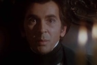 Drakula (Frank Langella) stares past candlelight in Dracula (1979).