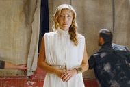 Soyona Santos (Dichen Lachman) wears a white gown in Jurassic World Dominion (2022).