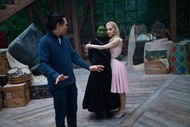 Jon M. Chu directs Elphaba (Cynthia Erivo) and Glinda (Ariana Grande) on the set of Wicked (2024).