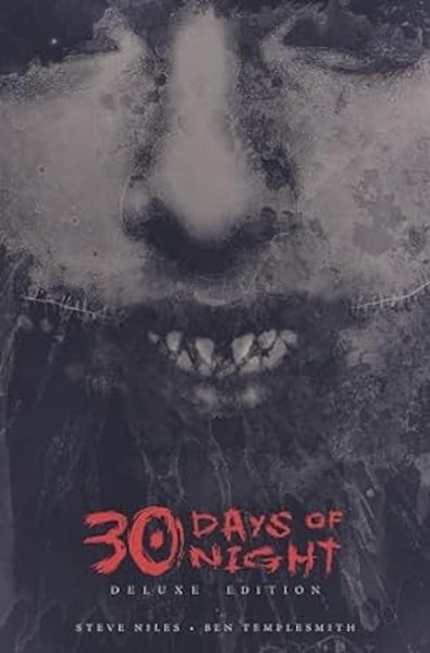 A fanged face is on the cover of 30 Days of Night Deluxe Edition: Book One.