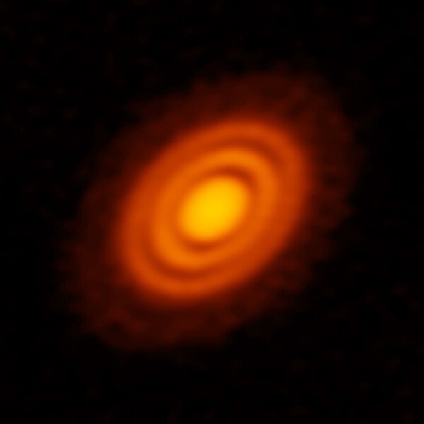 The disk of gas and dust around HD 163296 has gaps in it, carved by planets forming around the star. Credit: ALMA (ESO/NAOJ/NRAO); A. Isella; B. Saxton (NRAO/AUI/NSF)