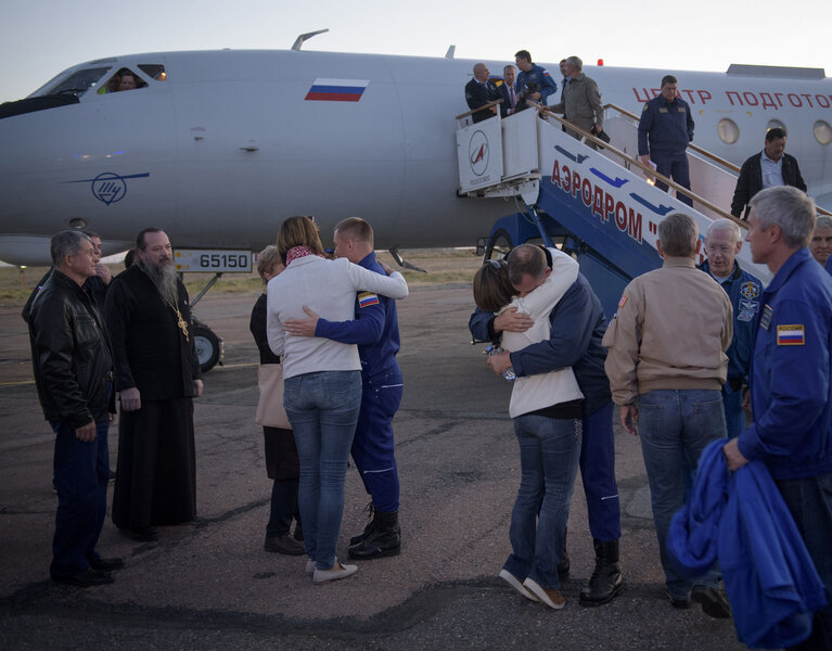 Cosmonaut Alexey Ovchinin (left) and astronaut Rick Hague (right) embrace their families after returning to Kazakhstan. Their flight to the ISS failed to achieve orbit after a Russian Soyuz rocket failed during launch. Credit: NASA/Bill Ingalls 