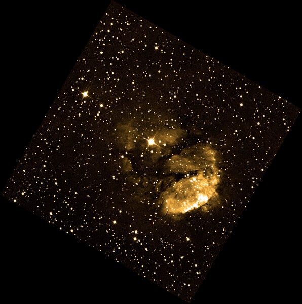 RCW 120 looks very different in visible light (specifically, monochromatic red) than it does in infrared. Seen here is the glow from warm hydrogen gas in the nebula, taken by the ESO Schmidt telescope. Credit: ESO