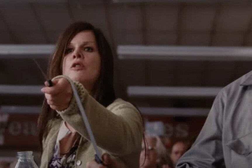 Mrs. Carmody points a sharp object in The Mist (2007).