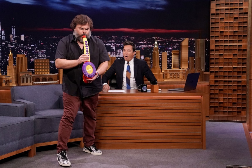 Jack Black plays the saxaboom during an interview with Jimmy Fallon on The Tonight Show With Jimmy Fallon Episode 0928